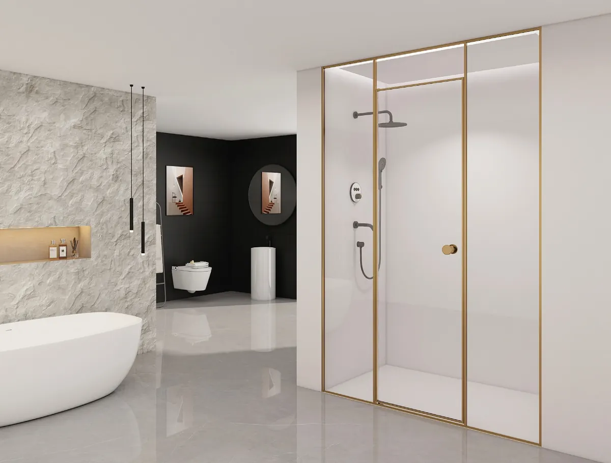 Gold framed shower enclosure in a modern bathroom